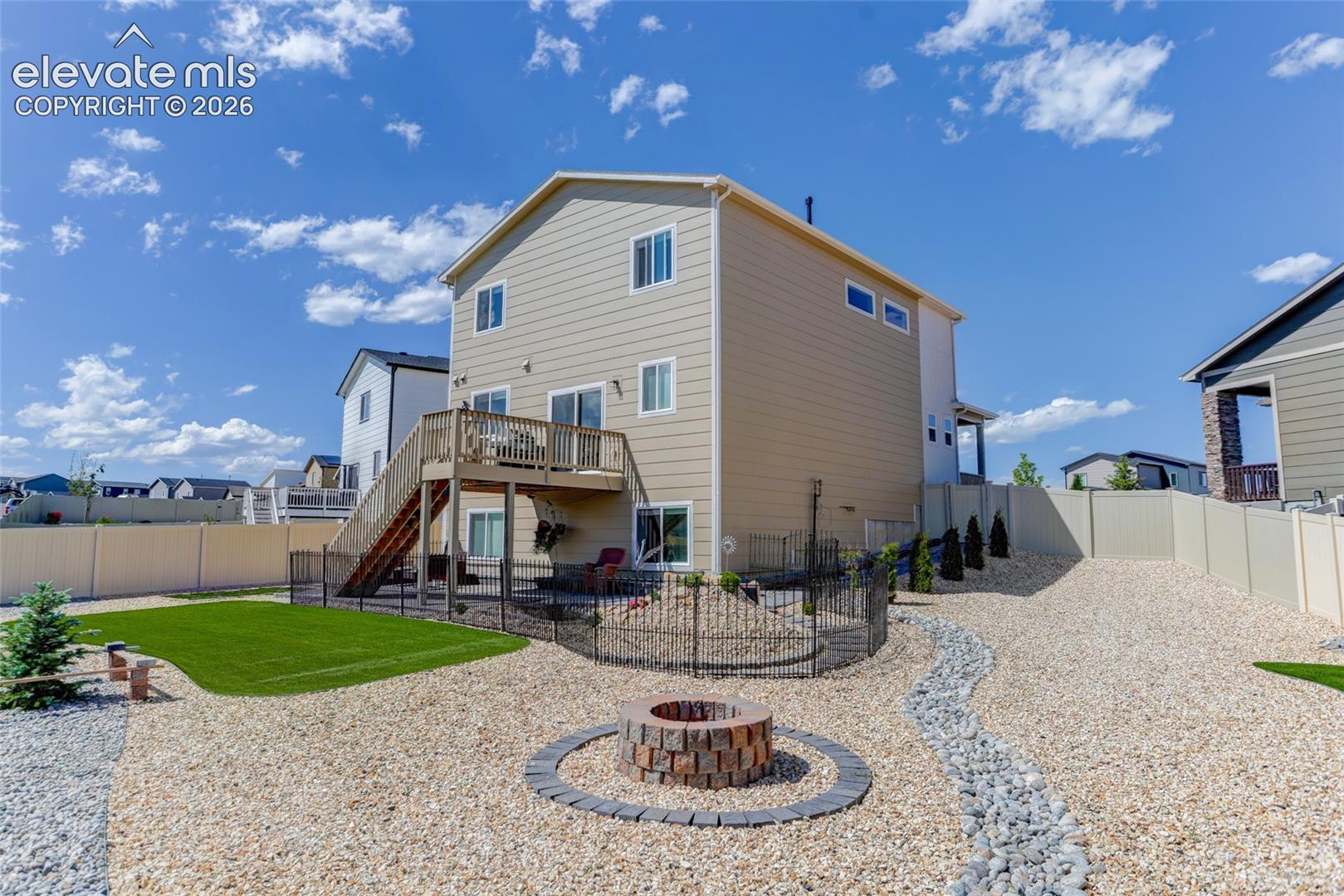 Fully fenced yard with firepit