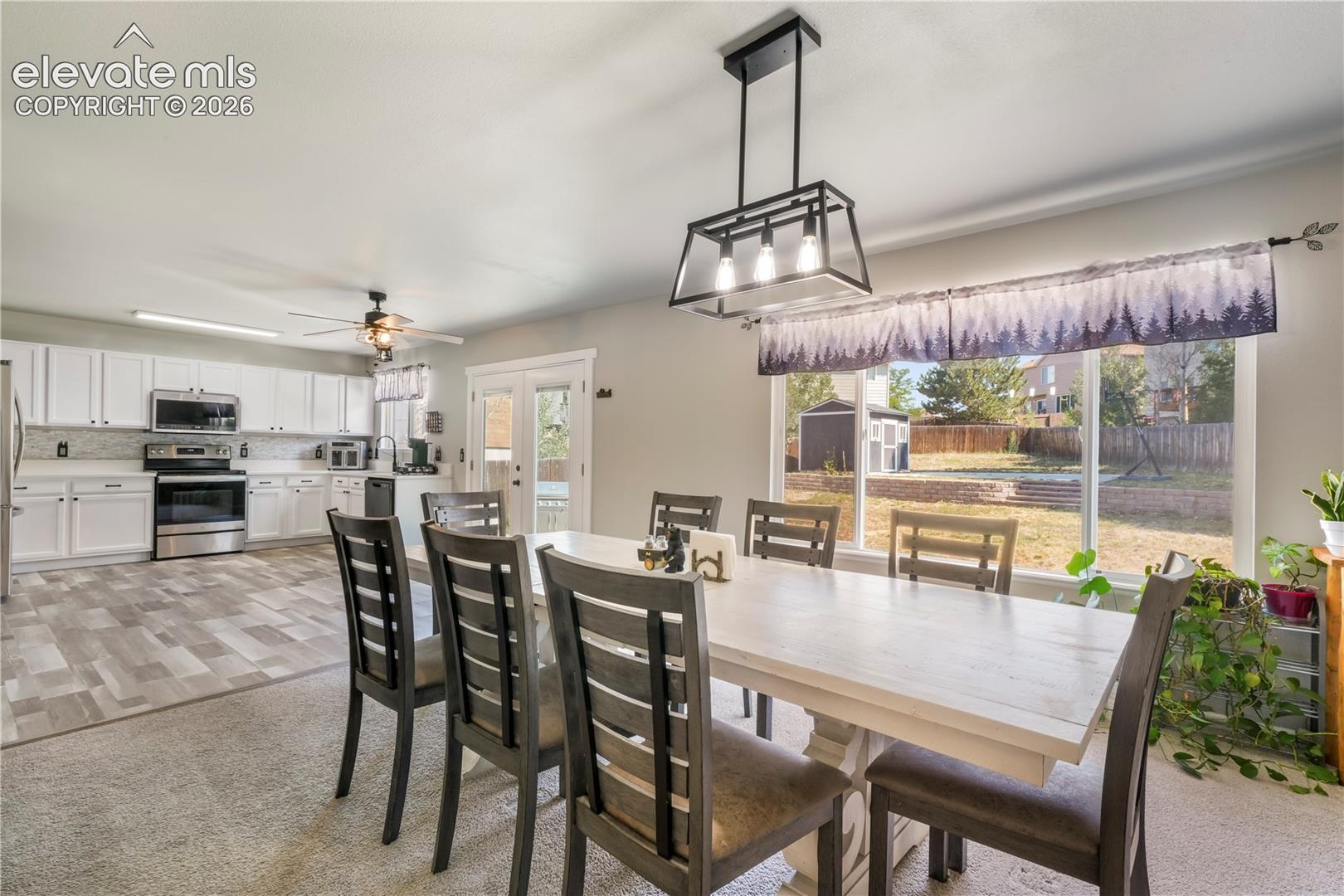 Currently staged as dining area, also family room with gas fireplace