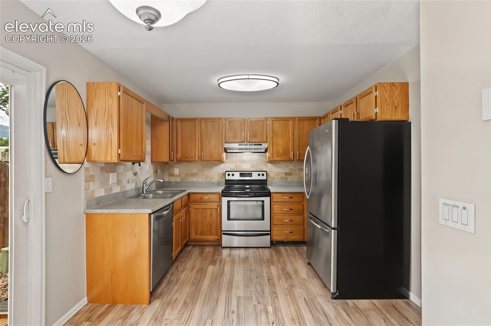 The kitchen features a brand-new dishwasher