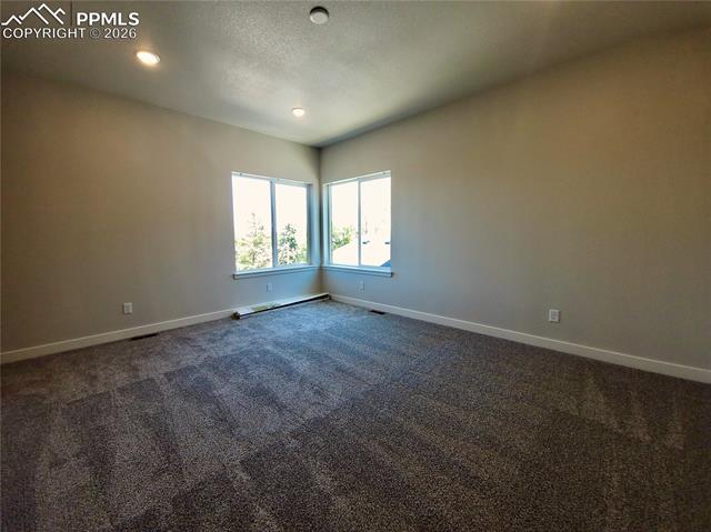 Spacious primary bedroom with 9ft ceiling