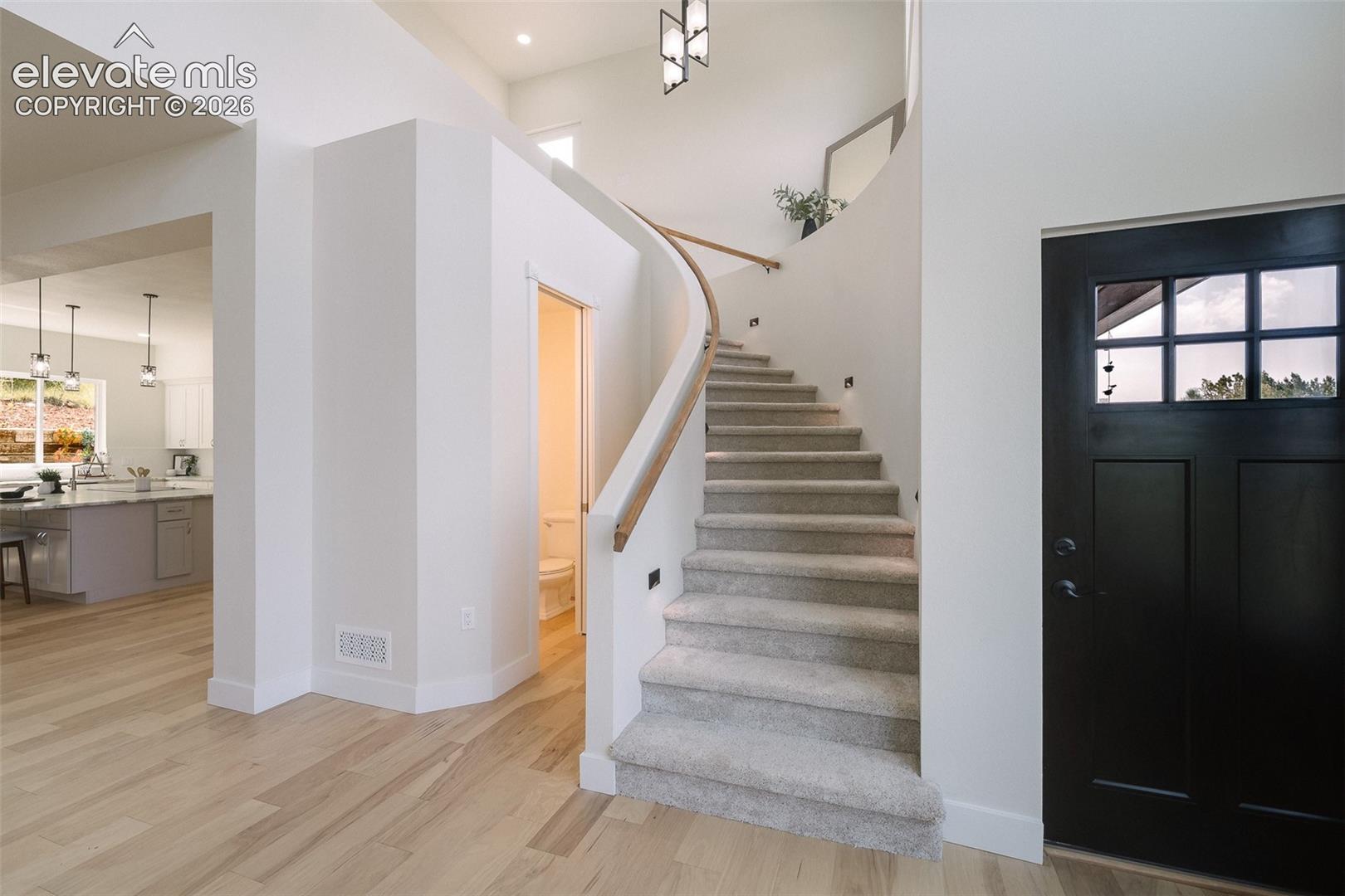 Spiral staircase to the upper level.