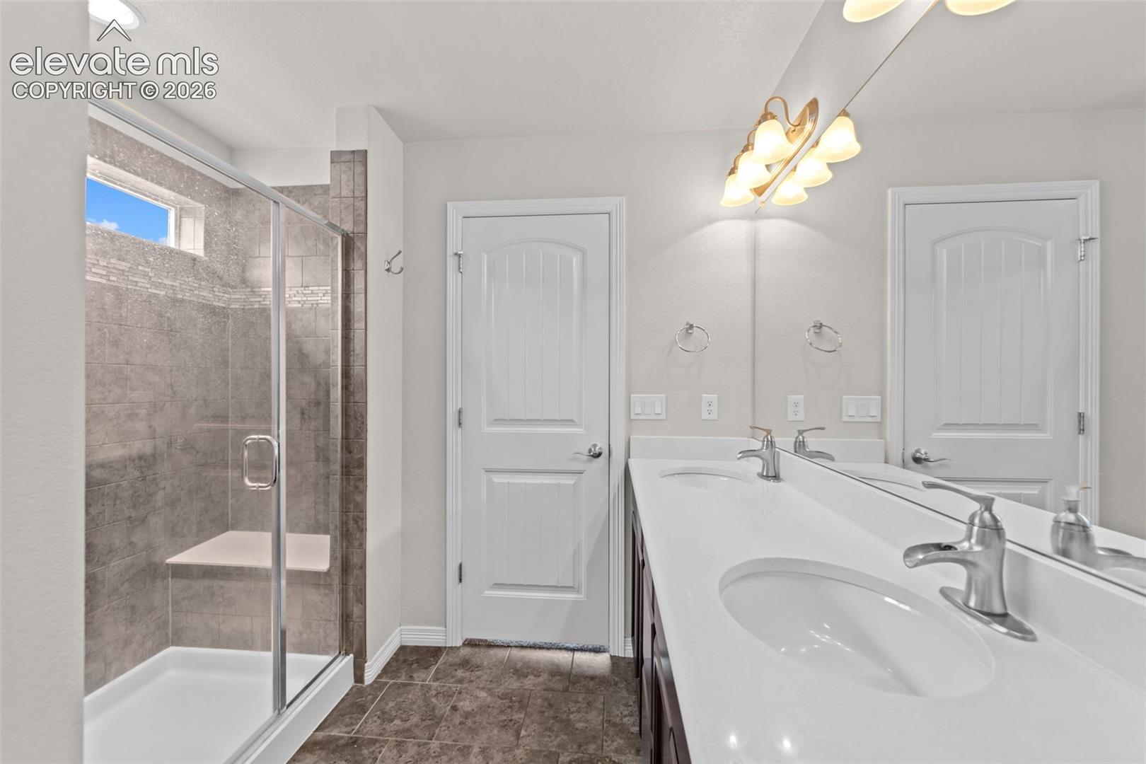Dual vanity with integrated sinks and chrome fixtures