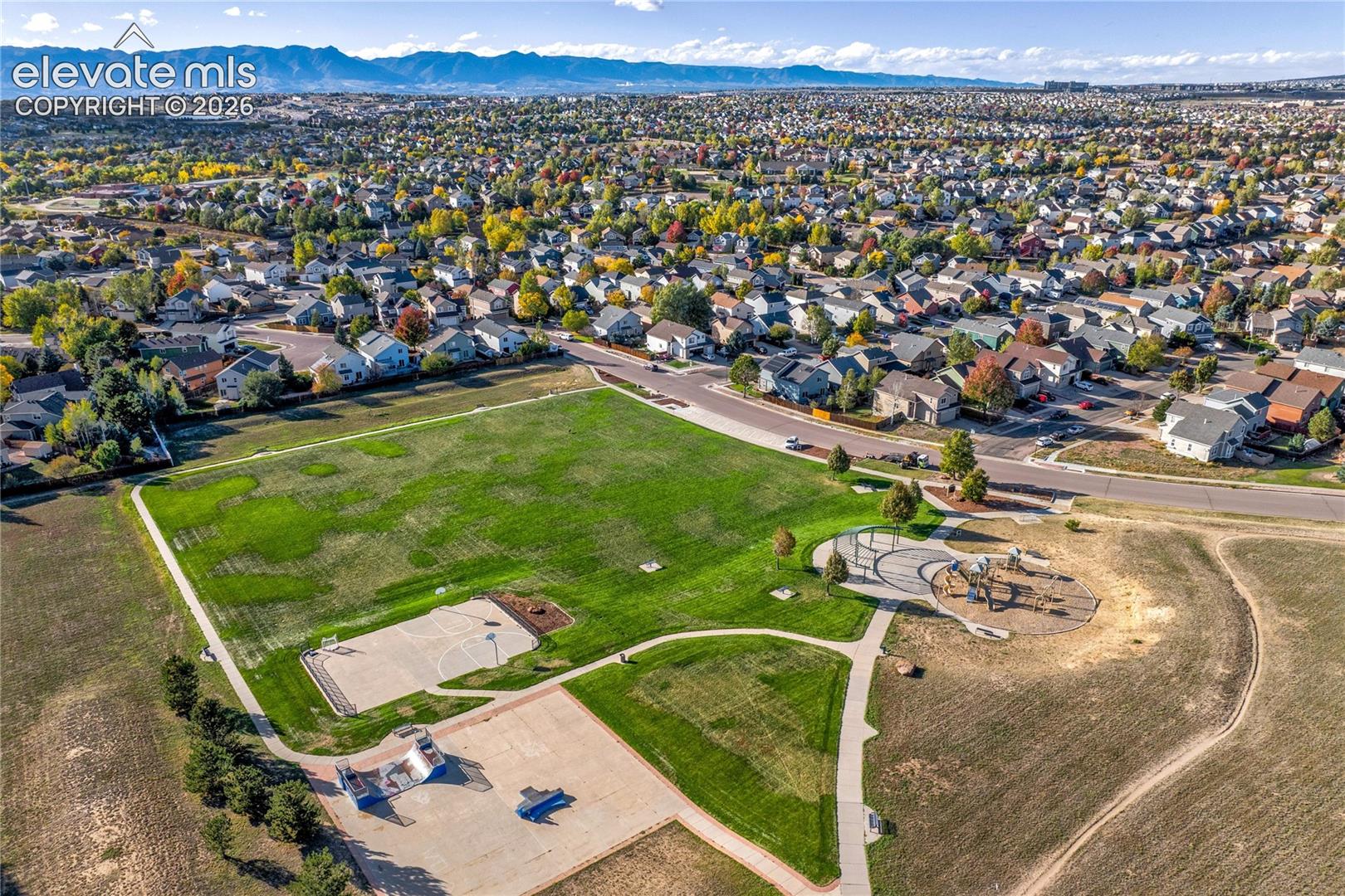 Expansive neighborhood parkland includes paved paths, open green space + recreational courts, offering a variety of ways to enjoy the outdoors.