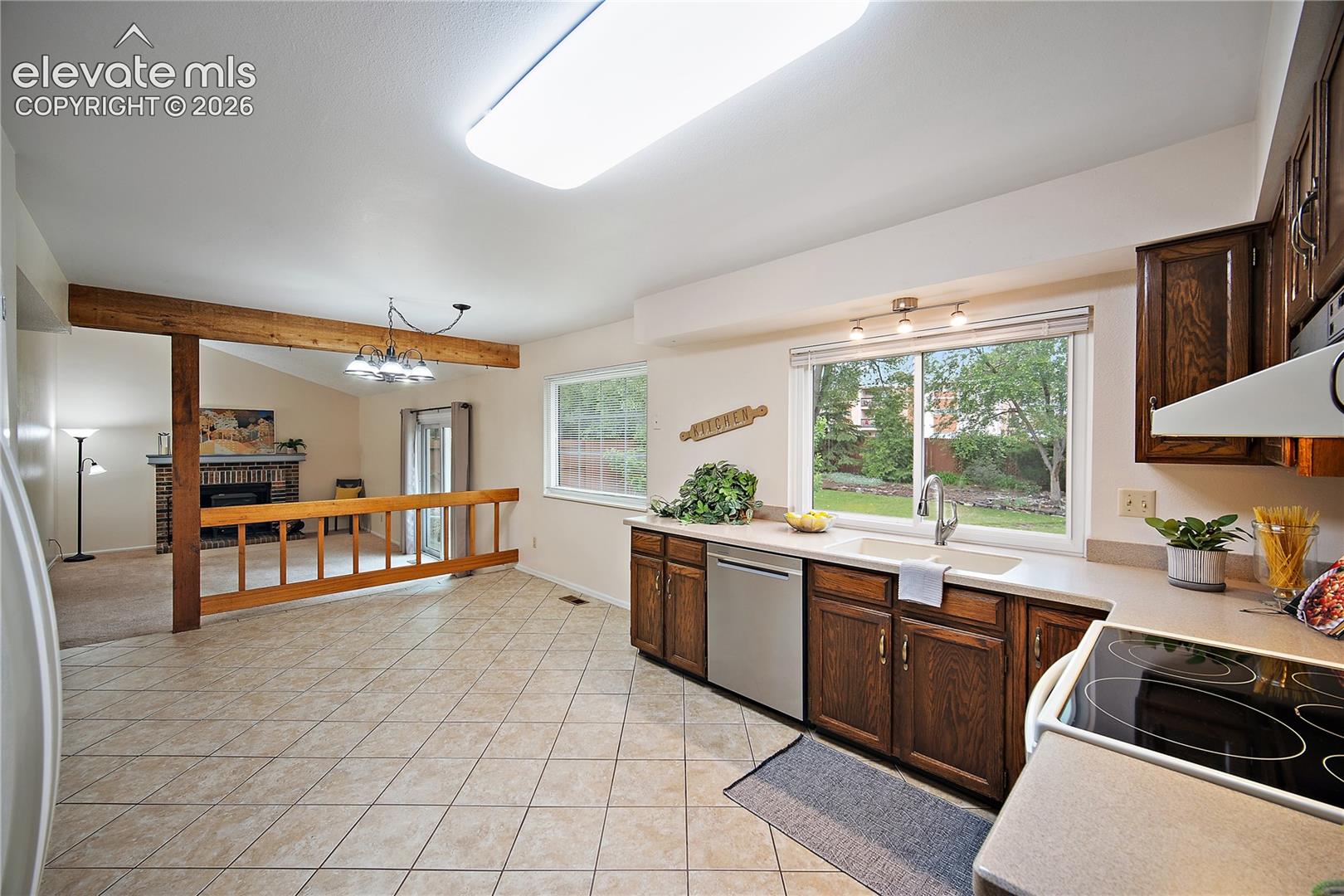 Spacious eat in kitchen, open to the family room with walk out to back yard.