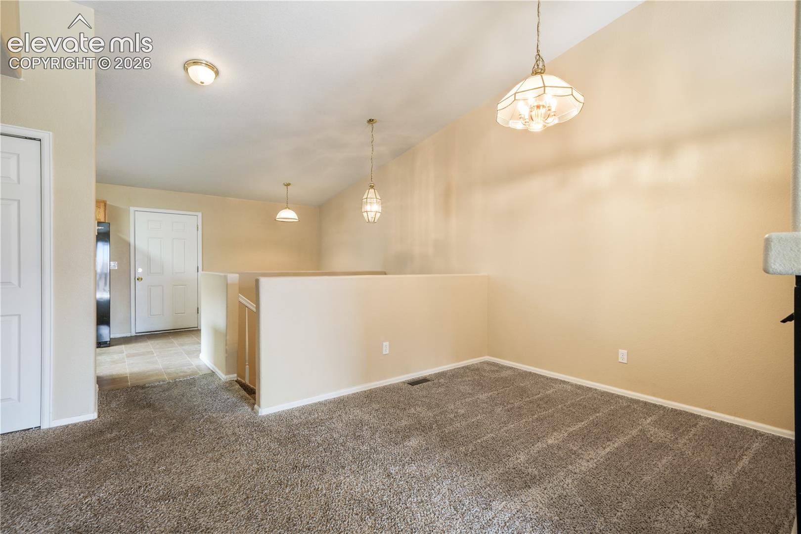 Dining area between kitchen eat in area and living room