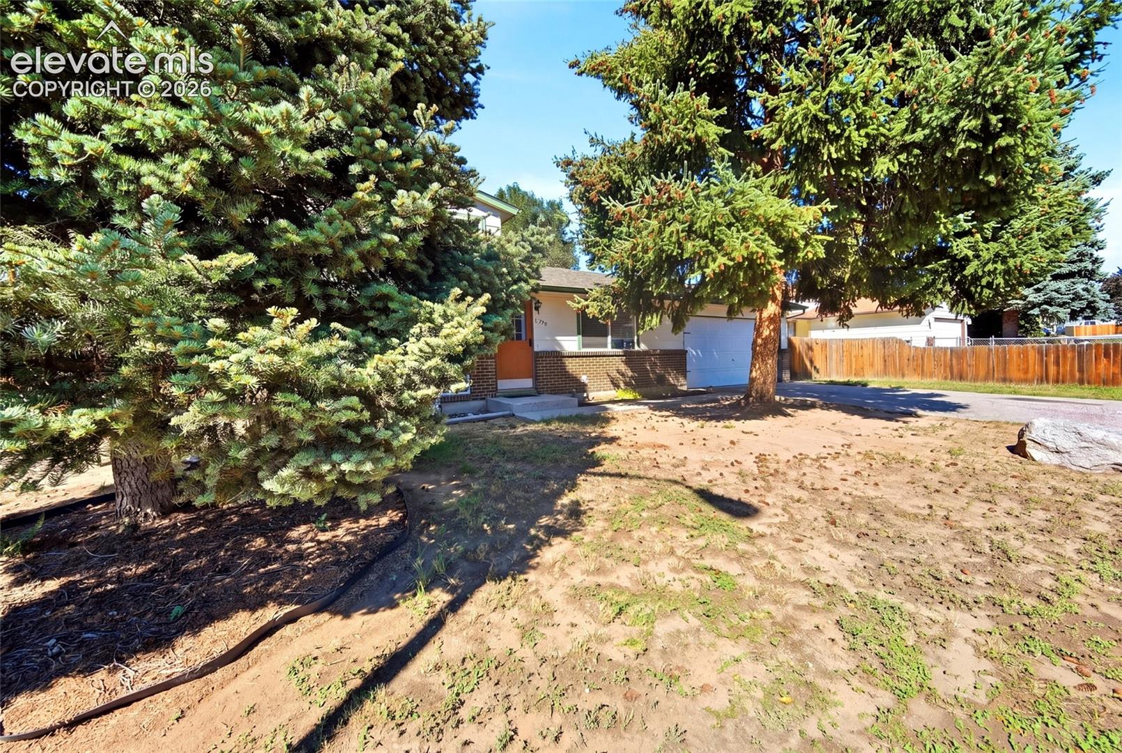 Rear yard, fenced, mature trees