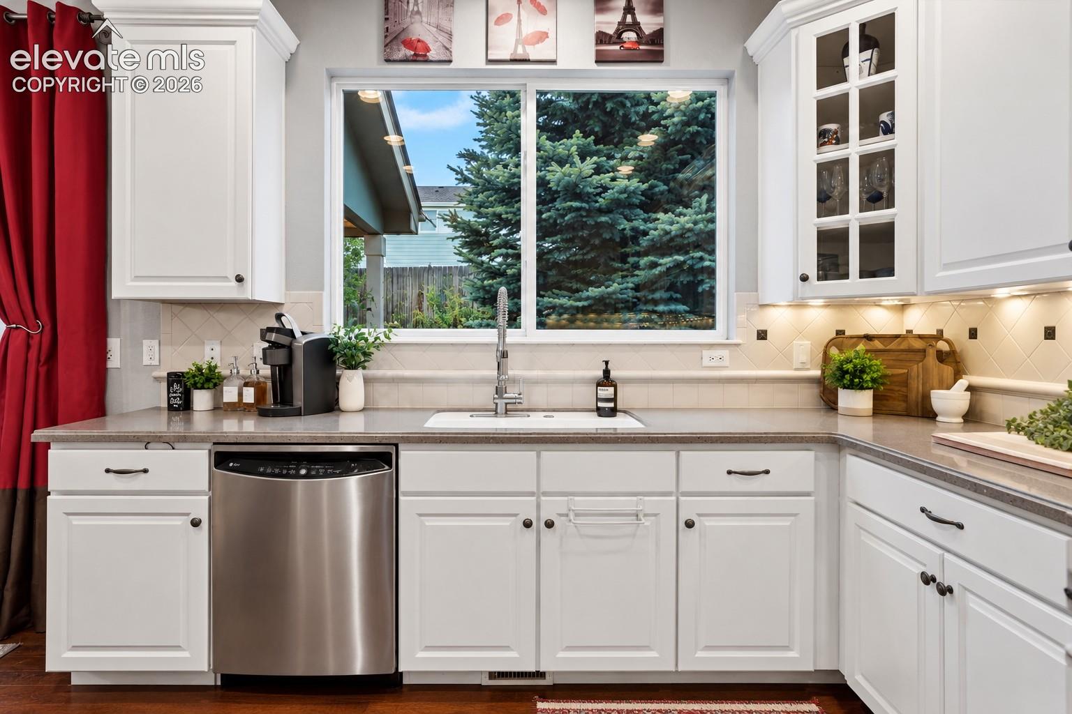 Natural light over the sink and thoughtfully arranged counter space make the kitchen feel bright and inviting.
