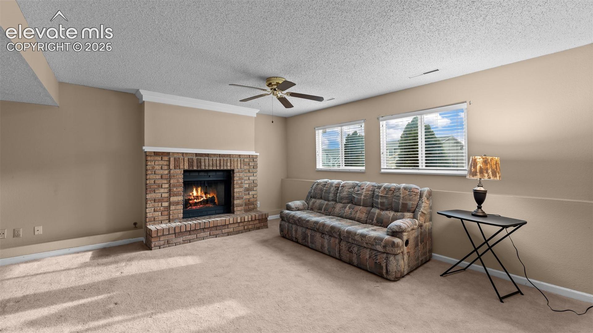 On the lower level find a large family room with large fireplace and wet bar.