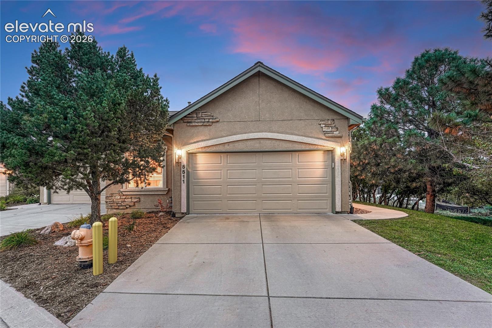 Two-car garage with epoxy flooring, stone accents!  Schedule your showing TODAY!
