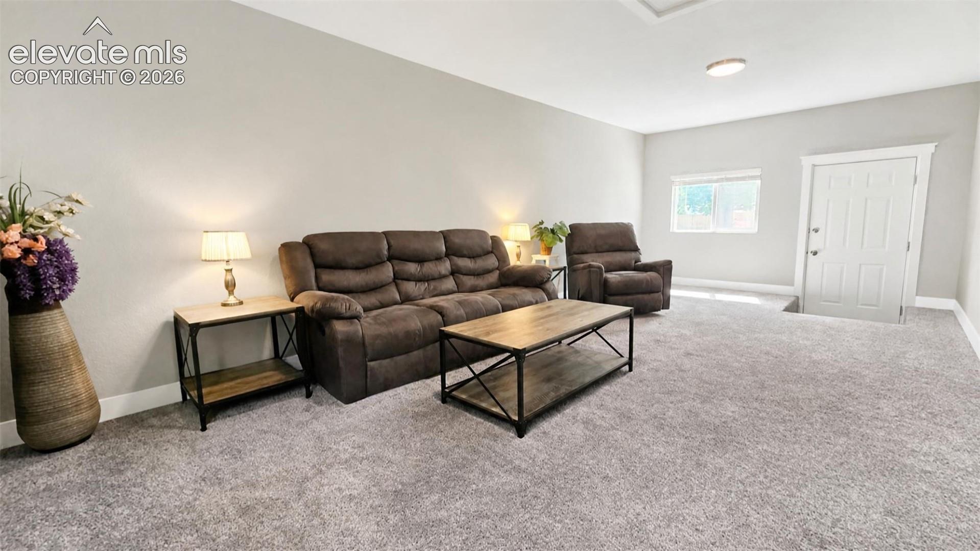 Light gray wall finishes and coordinating carpeting