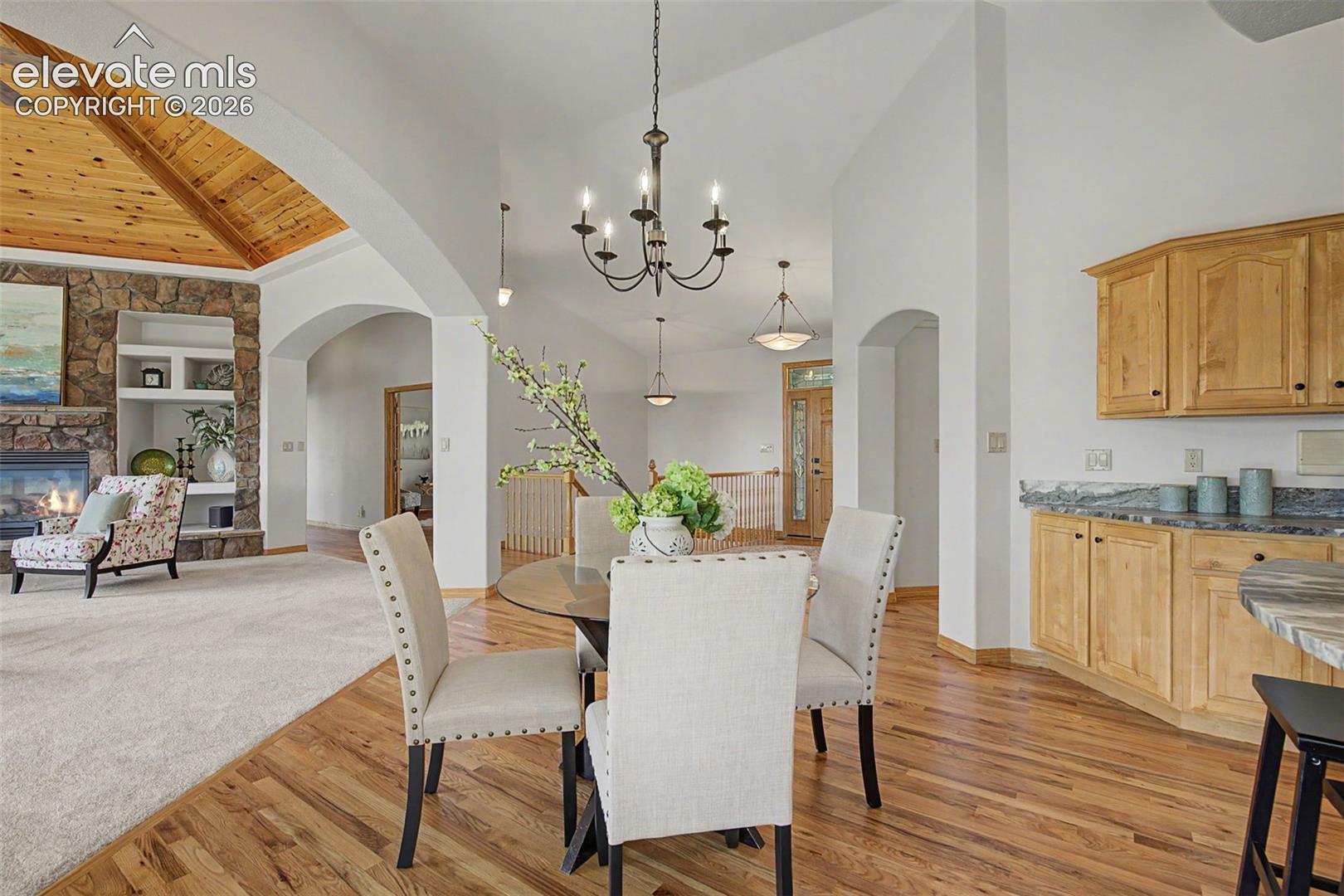 Vaulted wood-paneled ceiling with exposed beams