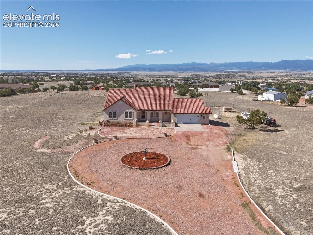 Expansive circular driveway creates an impressive approach while providing abundant parking for guests, recreational vehicles, trailers, or equipment.