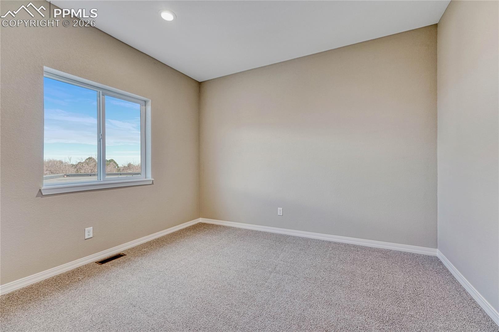 Two secondary bedrooms on upper level.