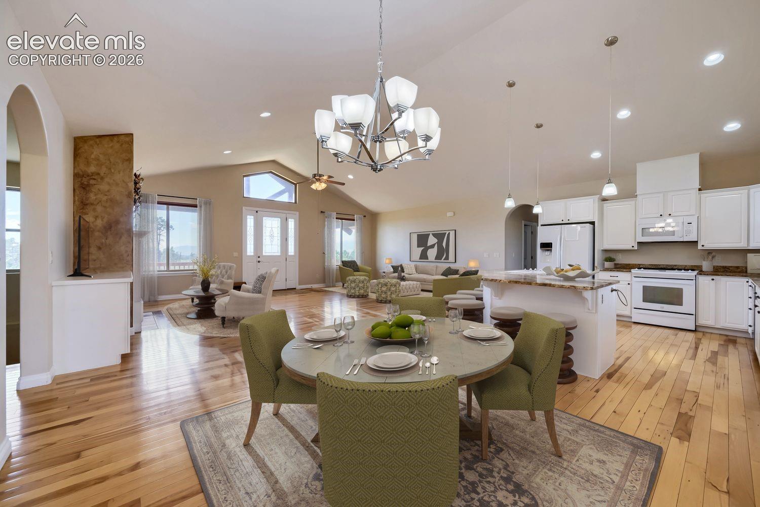 This kitchen features a large dining area with easy access to both the back covered deck and the kitchen. 