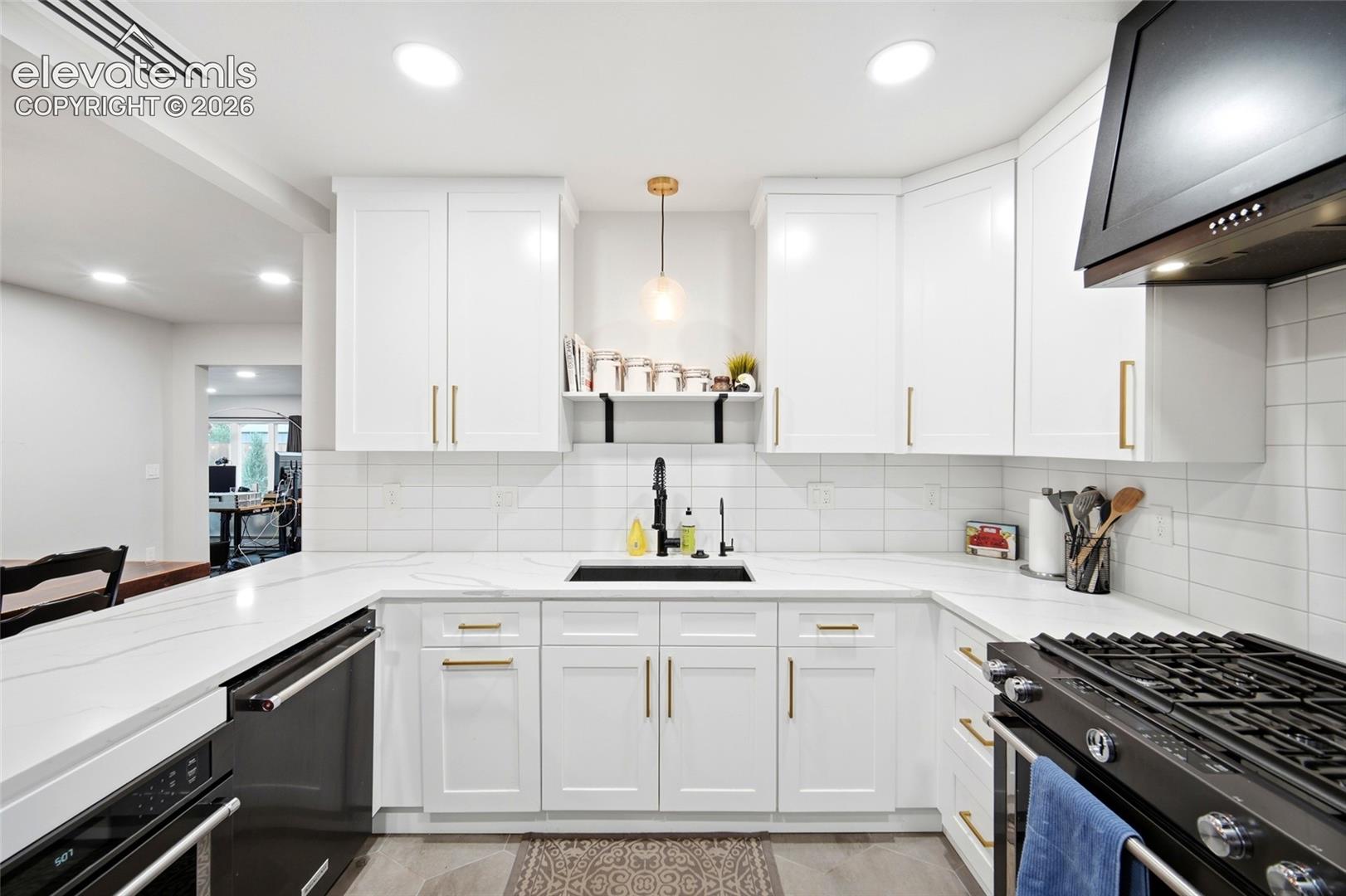 The open dining room is right off the kitchen, and the quartz countertops make it easy to serve straight from the kitchen. 