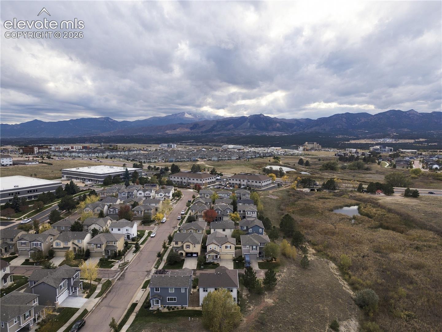 Aerial perspective featuring residential lots and proximity to natural mountain range topography