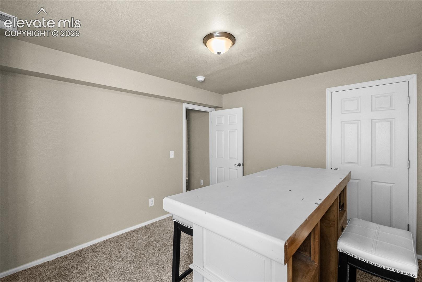 Carpeted flooring with painted walls