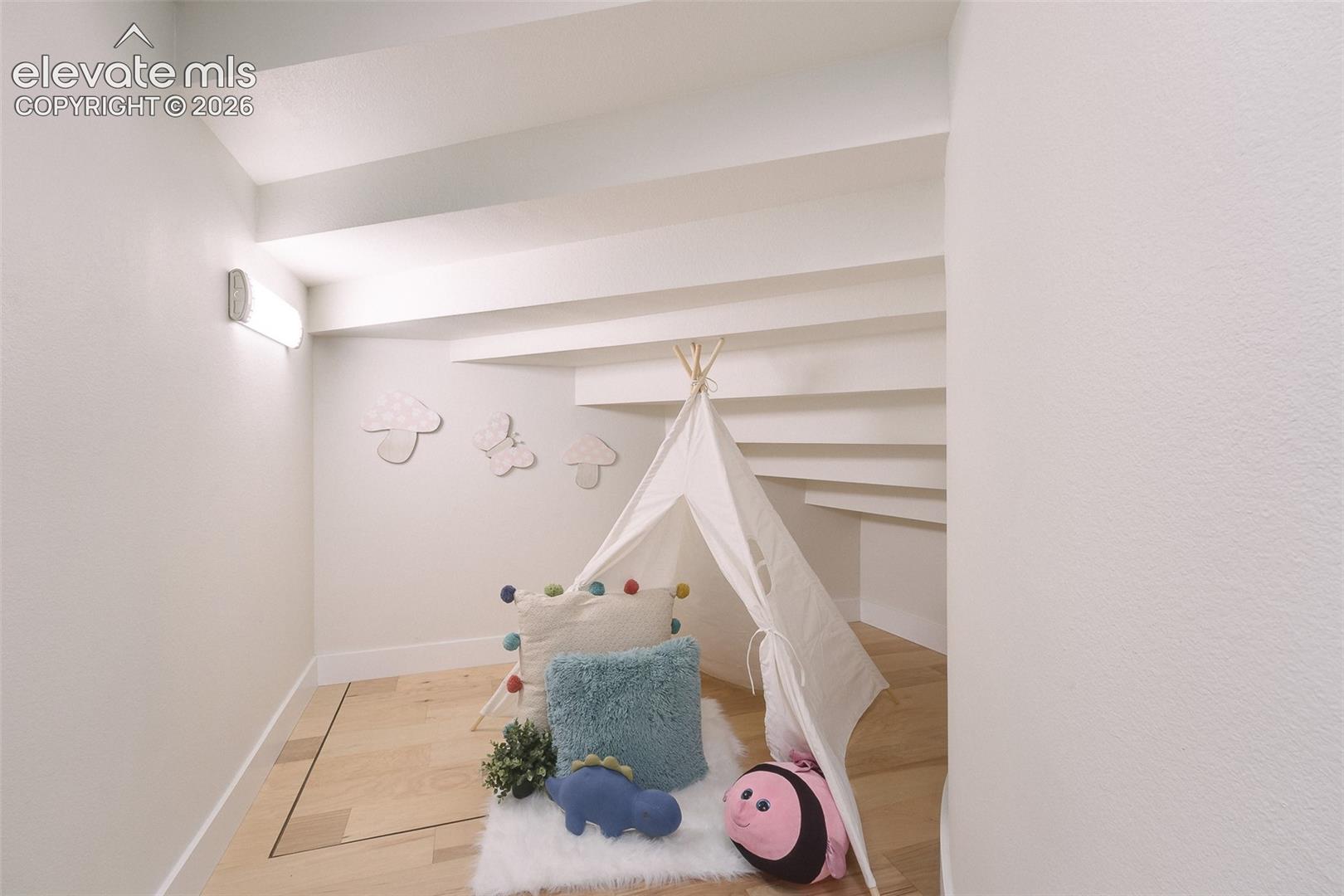 Spacious under stair storage or great for kid's reading or play nook.