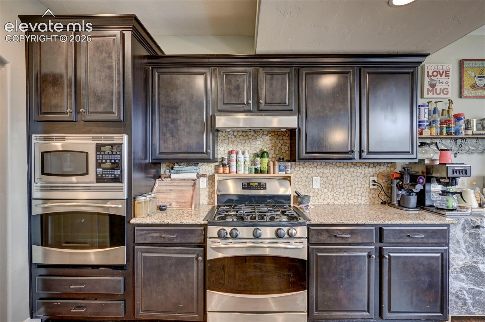 Kitchen with double oven and gas range