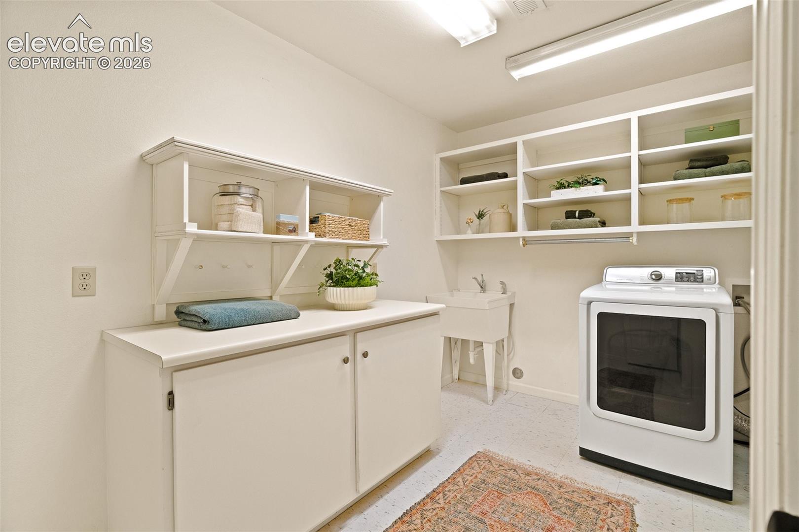 Basement laundry room photographed June 2026