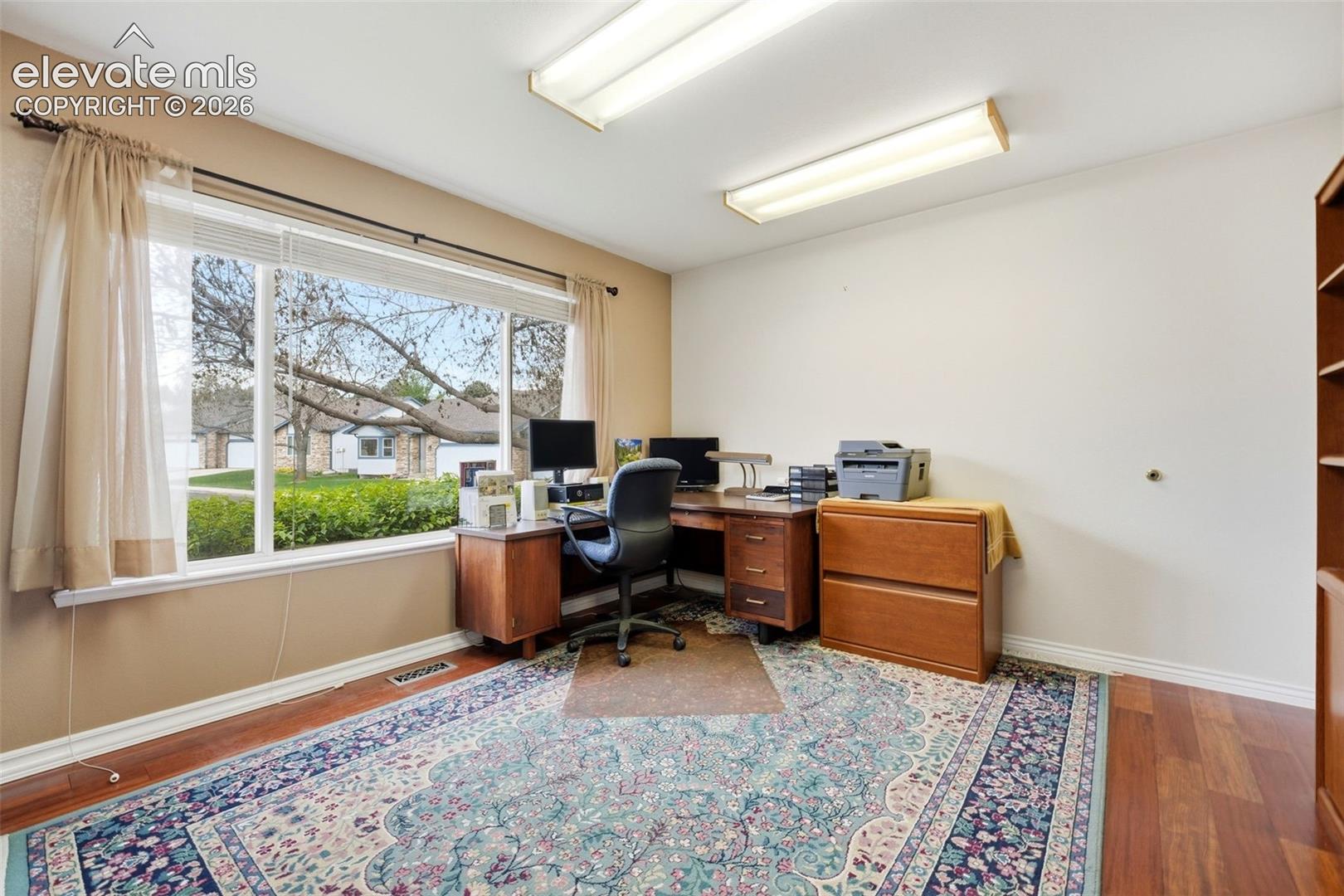 Second bedroom on main level  with walk in closet, currently used as an office.