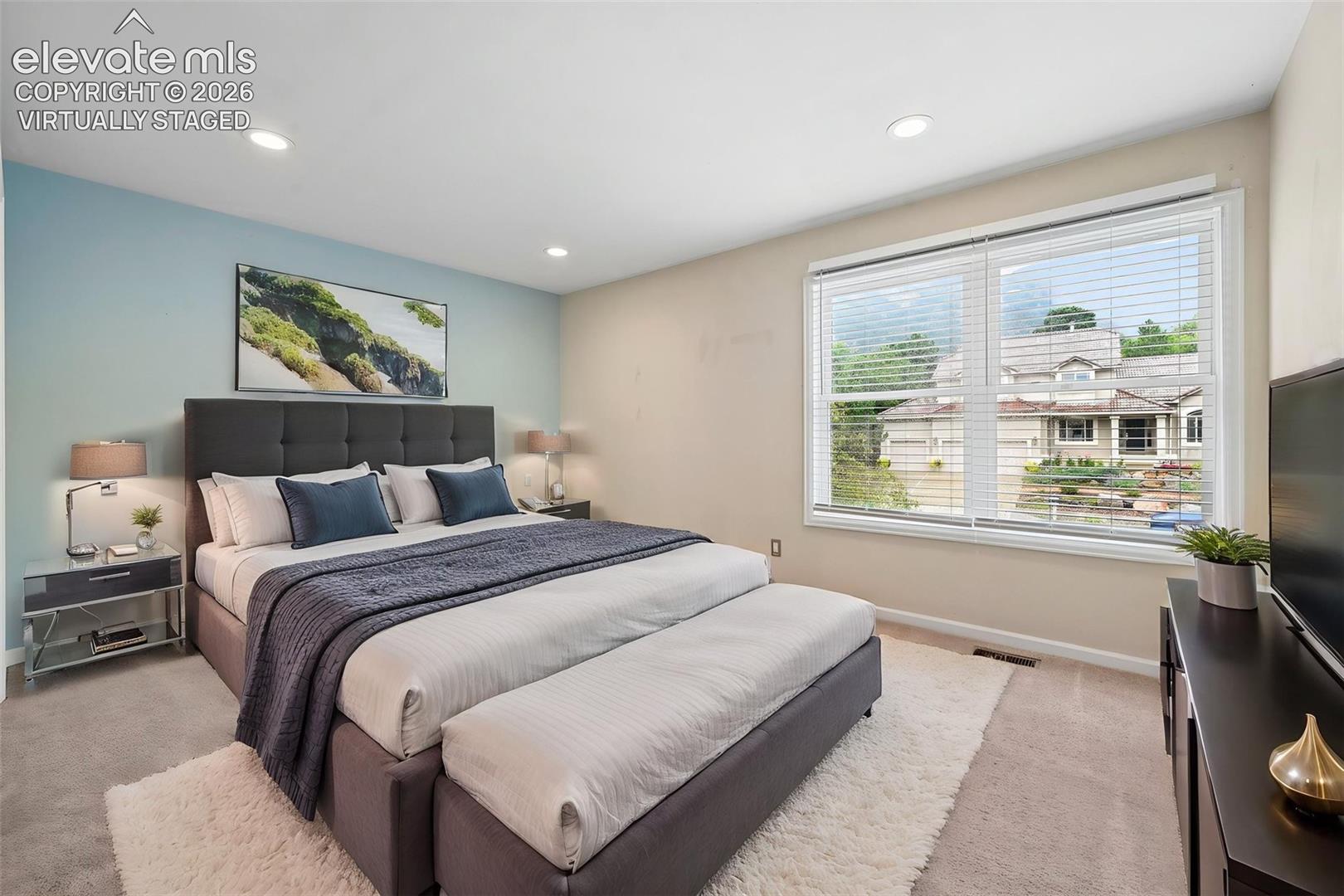 Virtually staged bedroom with incredible views of Cheyanne Mtn 