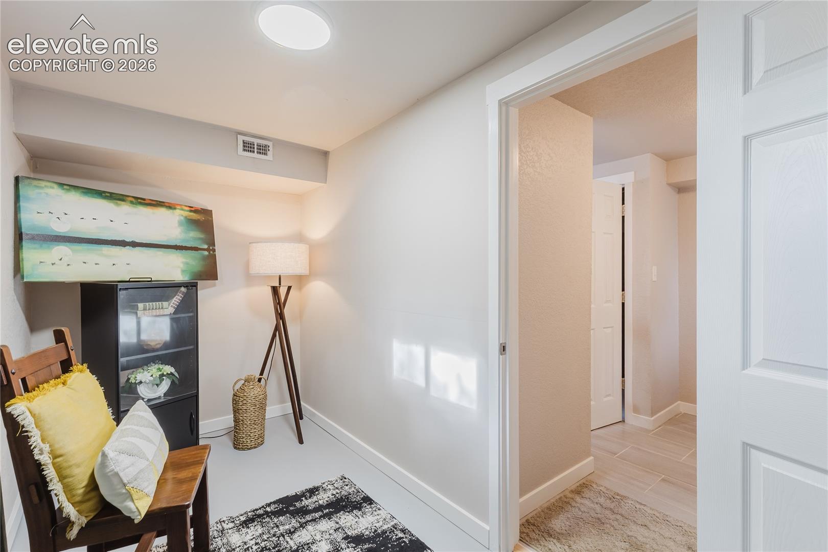 Storage room and walkout to the backyard through this room