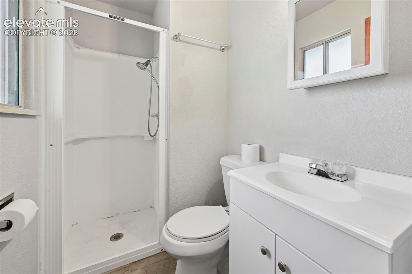 Master bath clean and white.  
