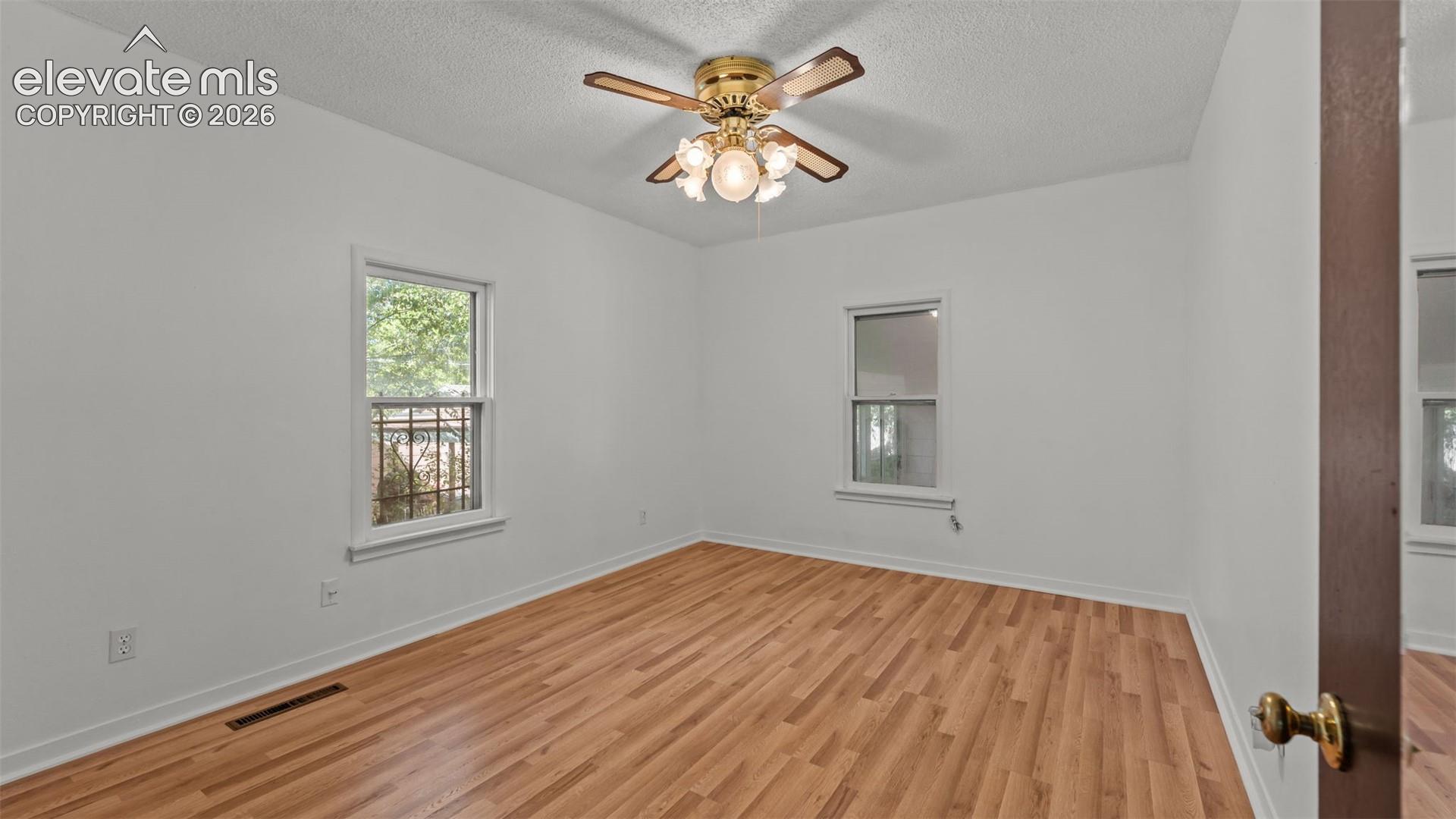 Wood-finish flooring with white walls