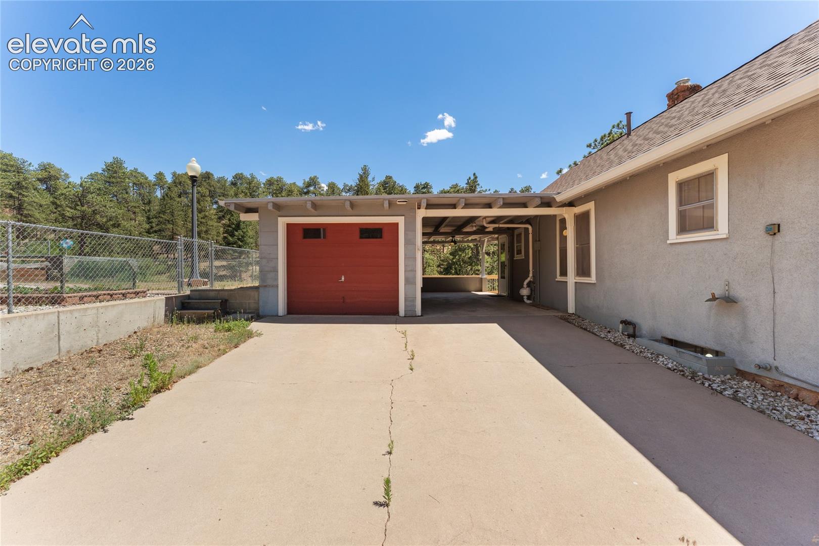 One car garage with room for a workshop at front end