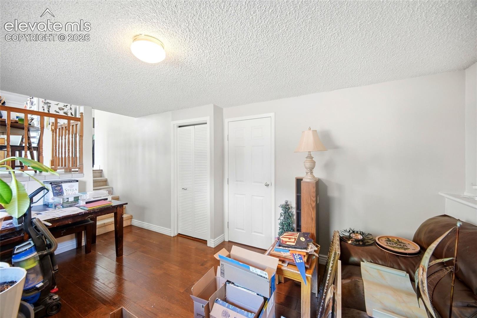 Lower level family room with wood flooring