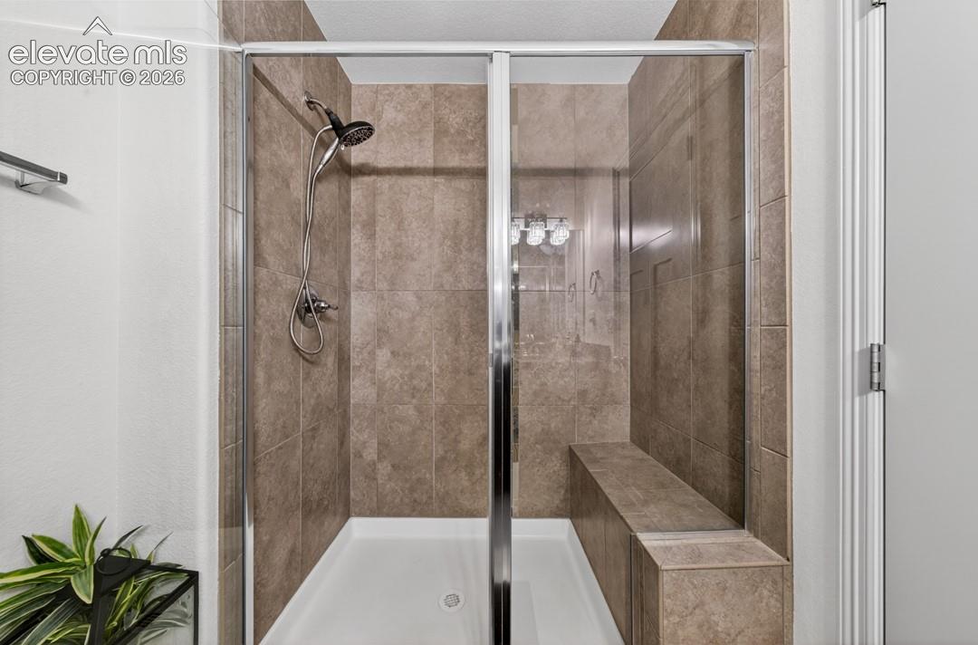 Main level, granite, tile shower w/ built-in bench