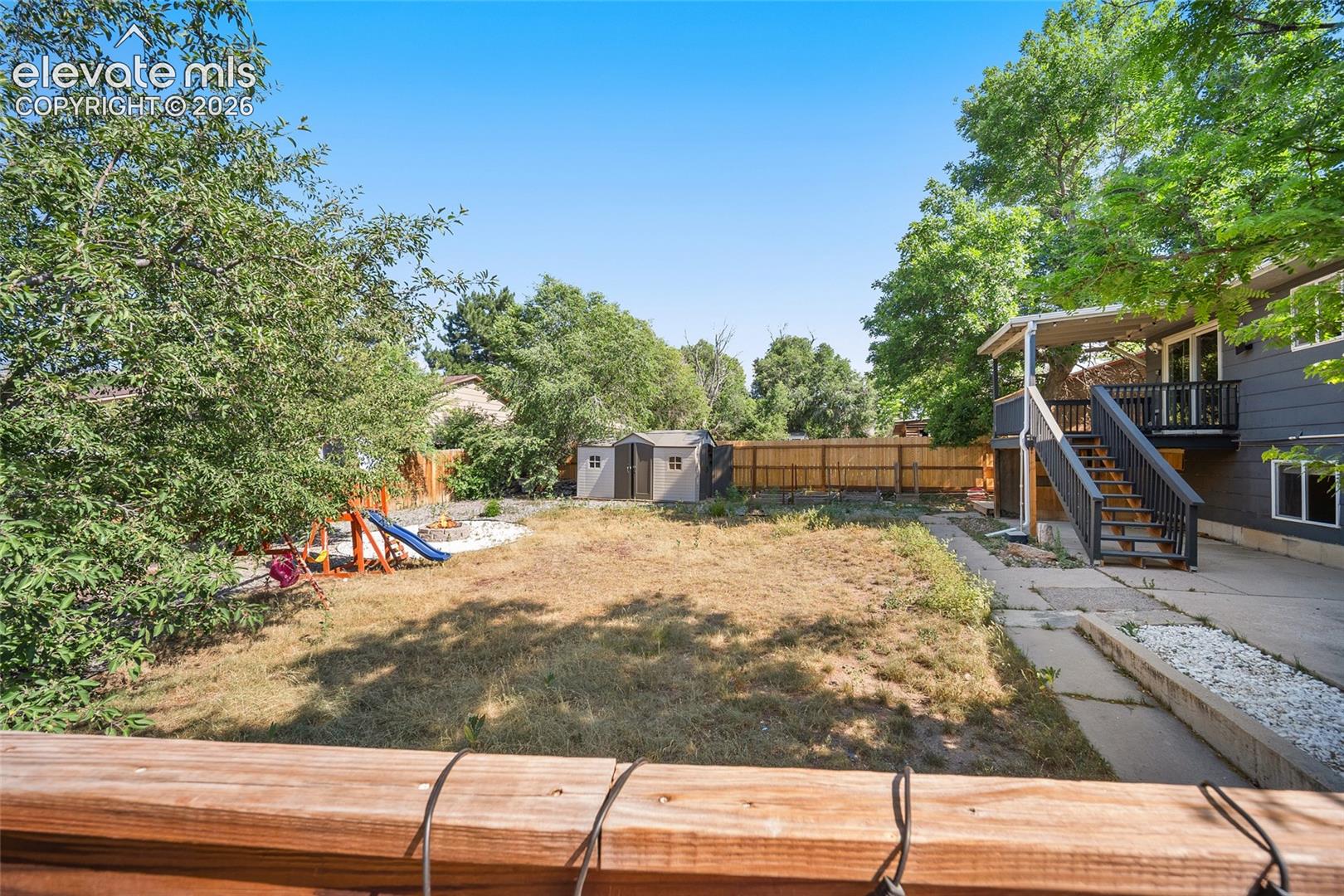 Backyard with view of deck.