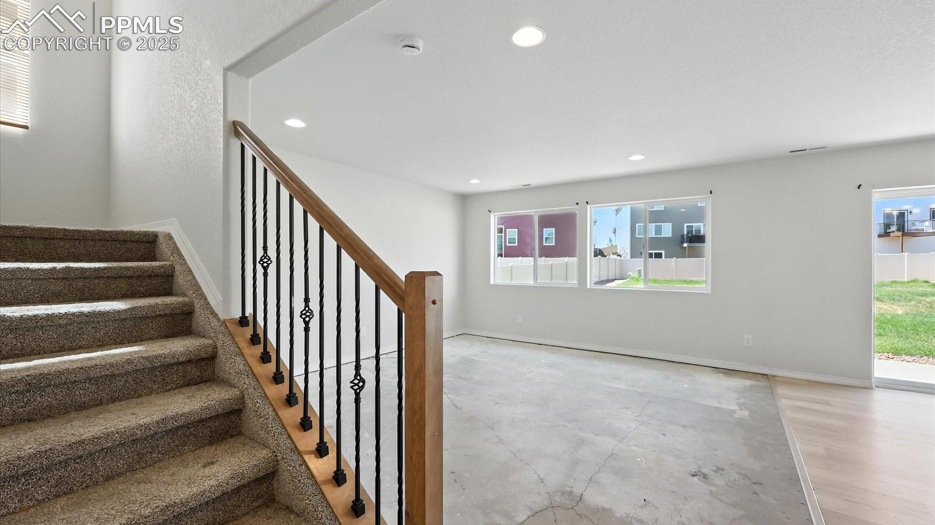 Living Room with views to the backyard (needs new flooring).