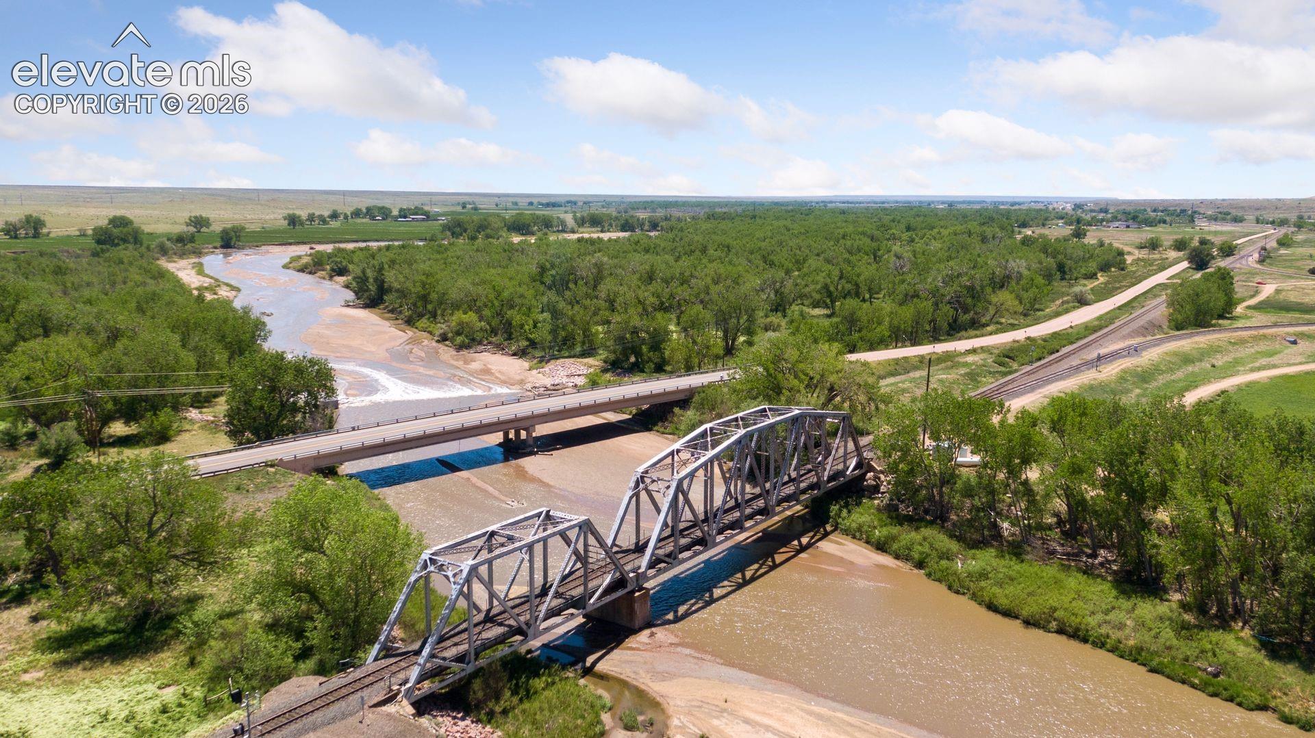 View near a corner of the property, illustrating Fountain Creek, adjacent transportation corridors, and the property’s strategic positioning within the surrounding landscape