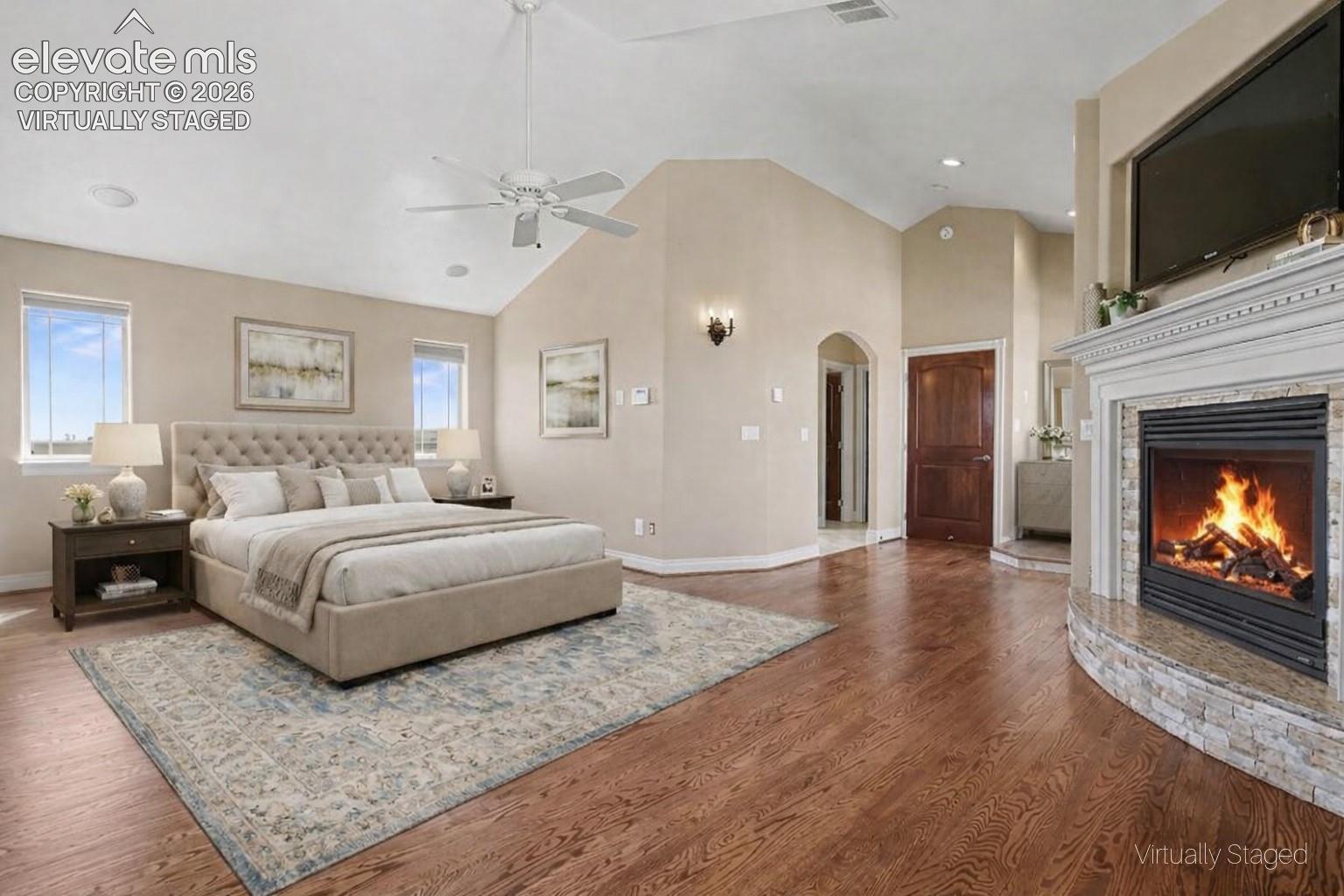 Virtually Staged - Primary Bedroom w/Fireplace, Balcony and 5-Piece Walk-in Bath