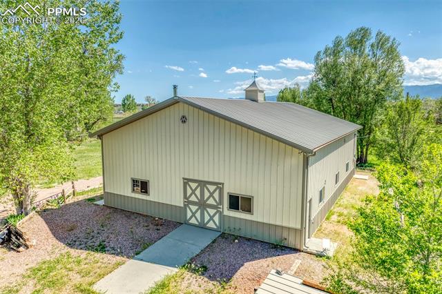 The outbuilding is elevated above the flood plain and located on the west side of the lot.
