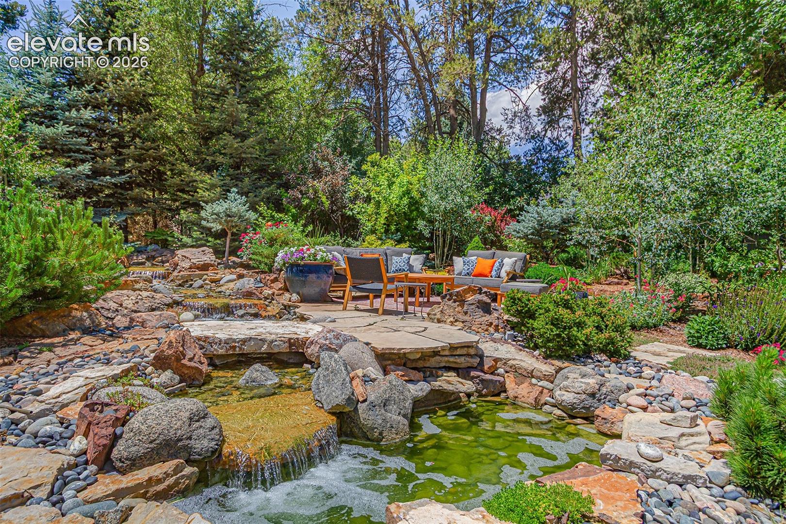 Sit next to the waterfall and enjoy the gardens.