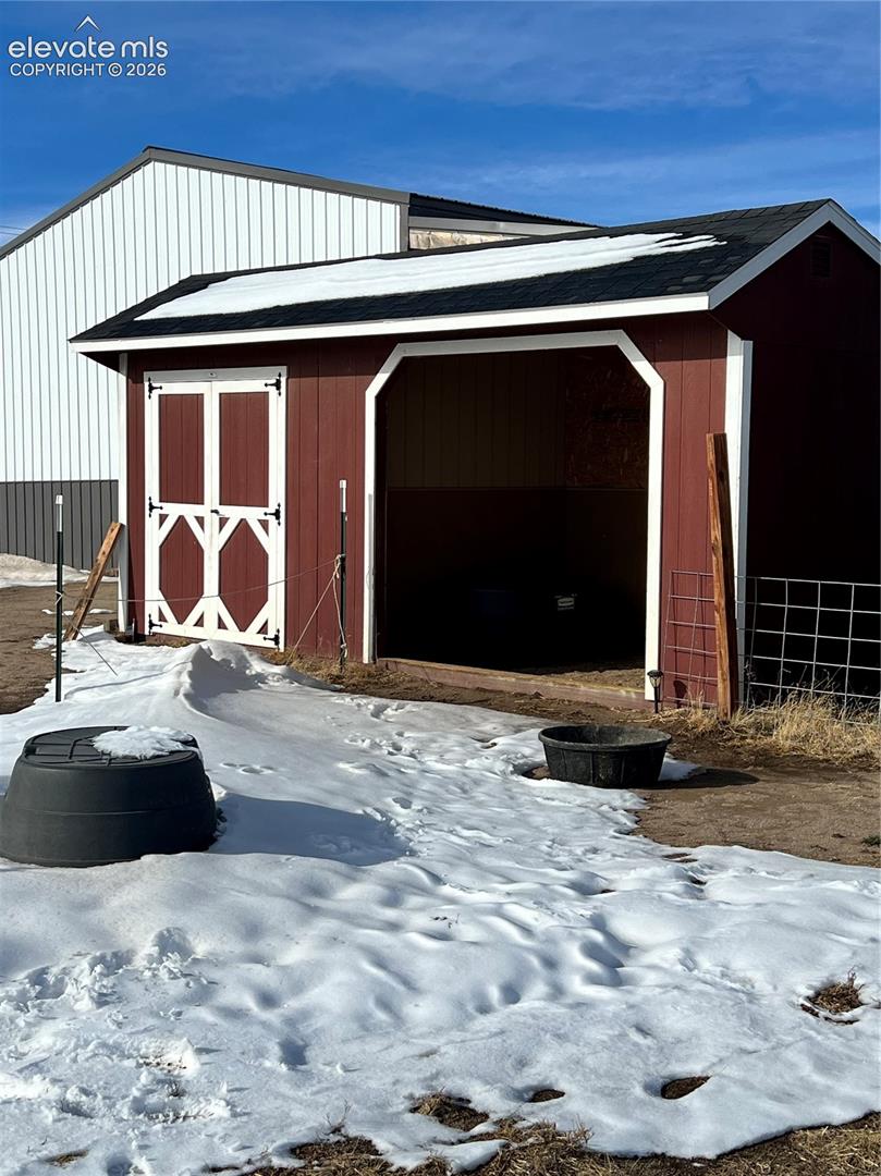 Separate loafing shed and tack room for horses, livestock, or gear