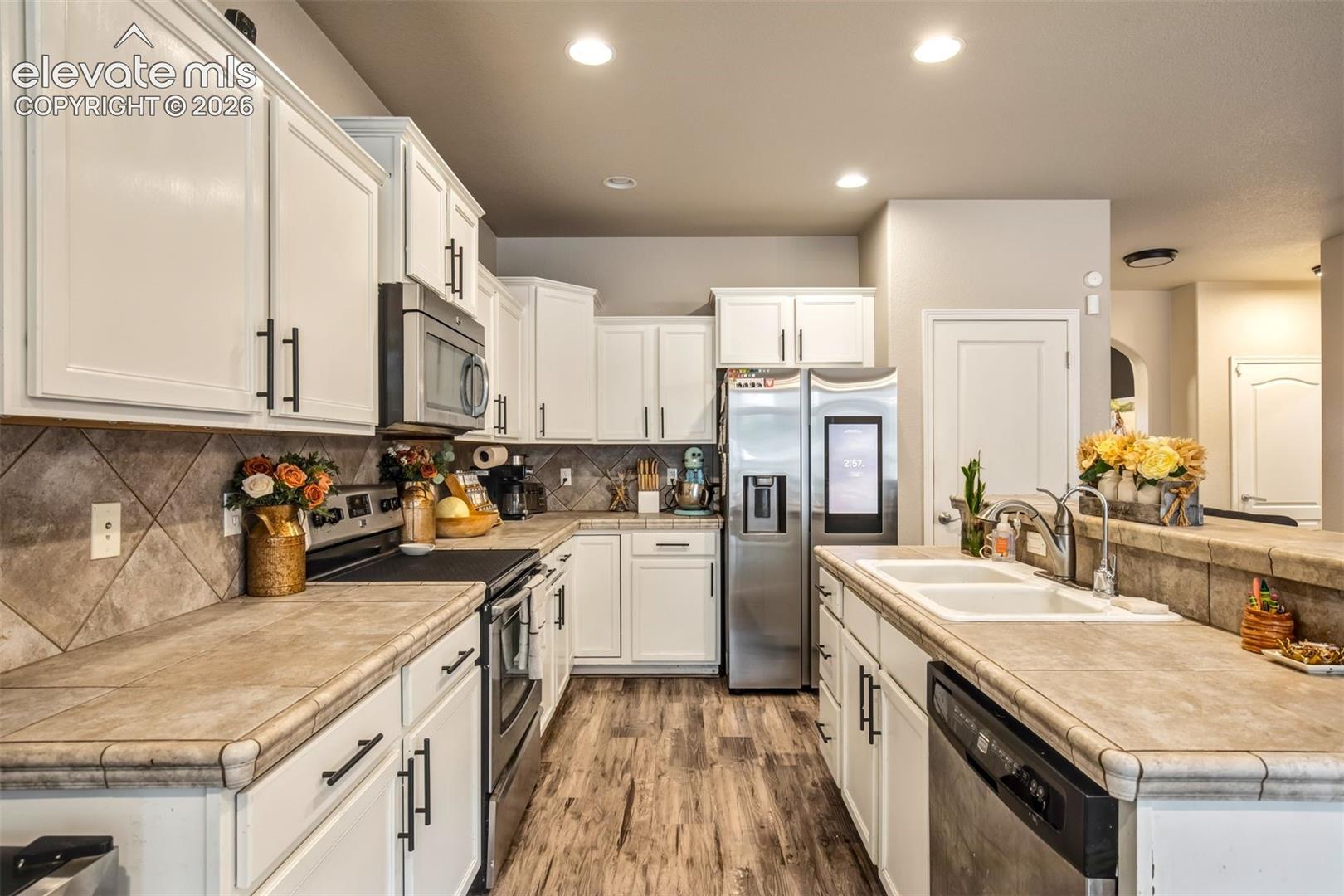 Kitchen pantry next to the fridge for extra storage
