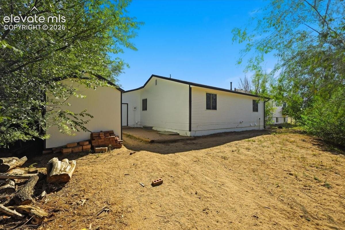 This property offers a large backyard and storage shed. 