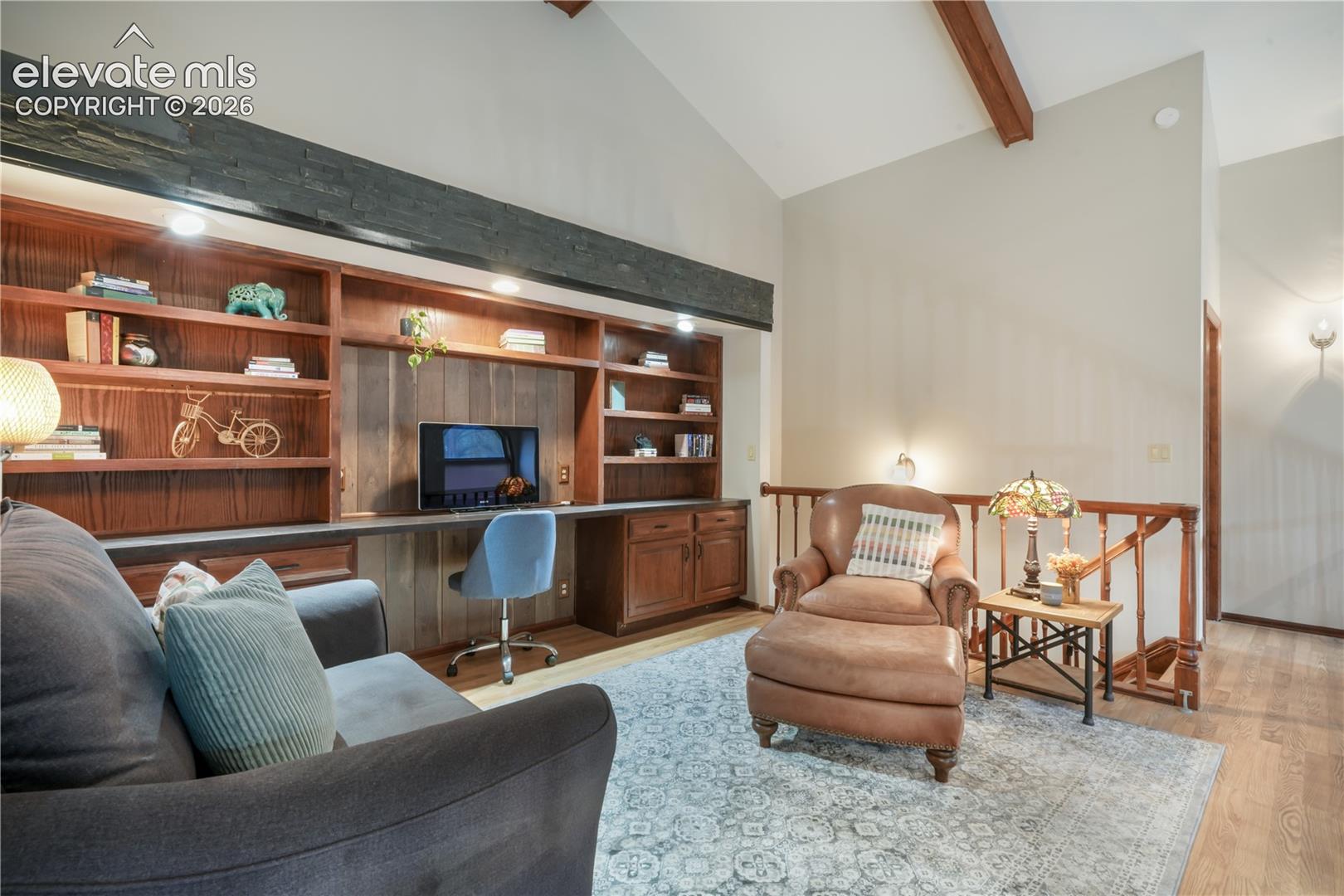 Upper level loft with beamed ceiling