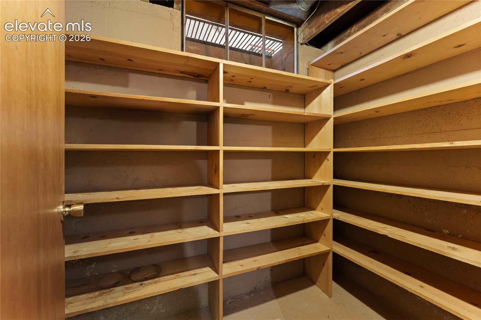 Just opposite the laundry room is this storage room with lots of shelving