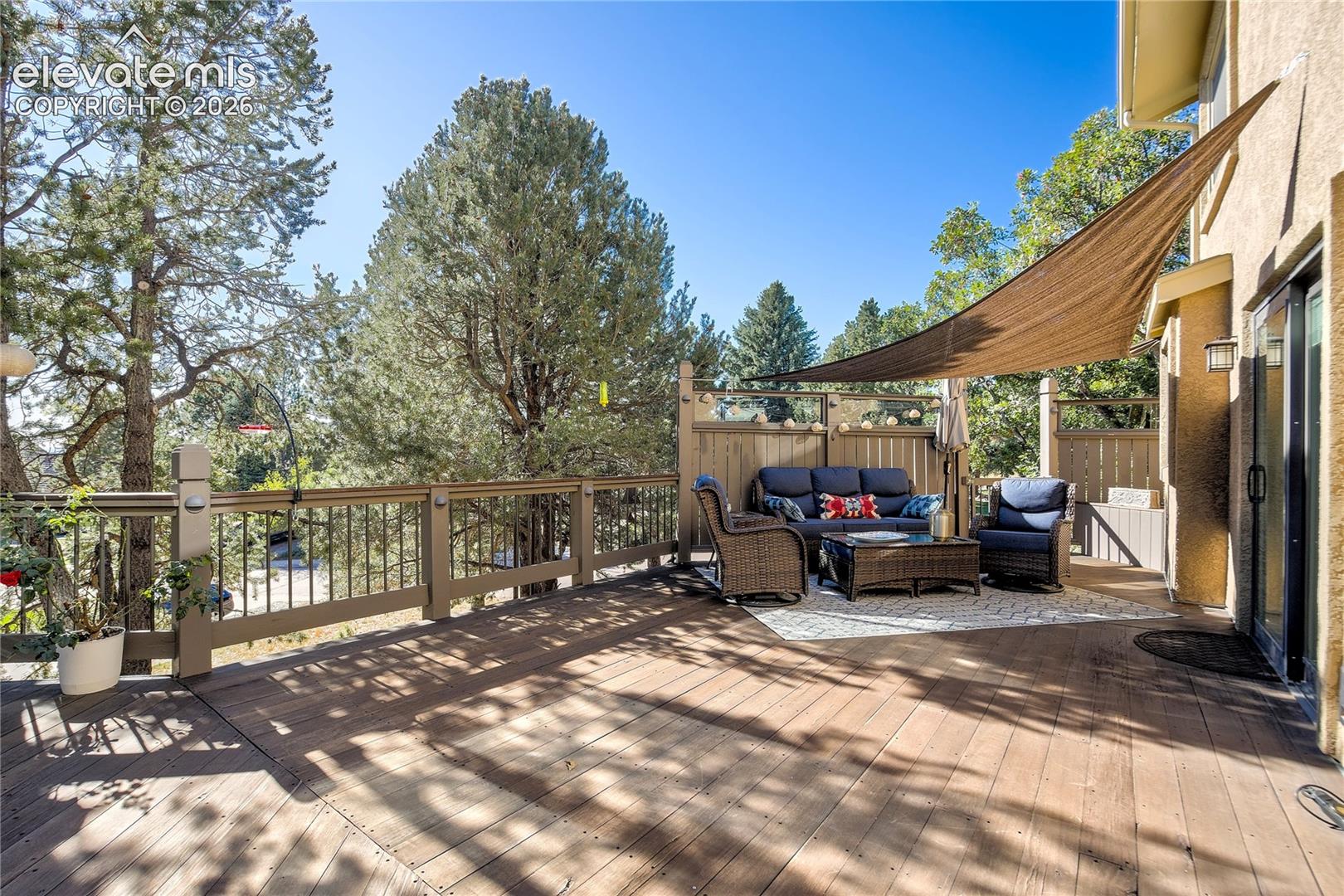 Surrounded by towering pines, the deck offers generous space for dining, entertaining + simply lingering outdoors.