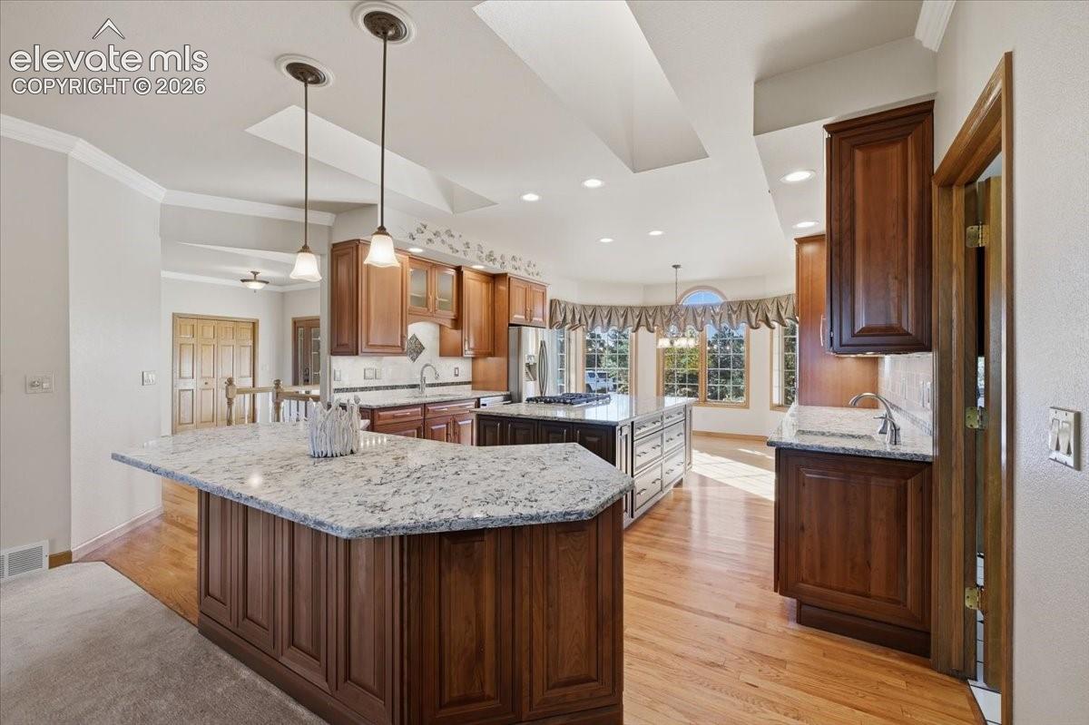 Breakfast bar seating offers the perfect separation between the kitchen and family room.
