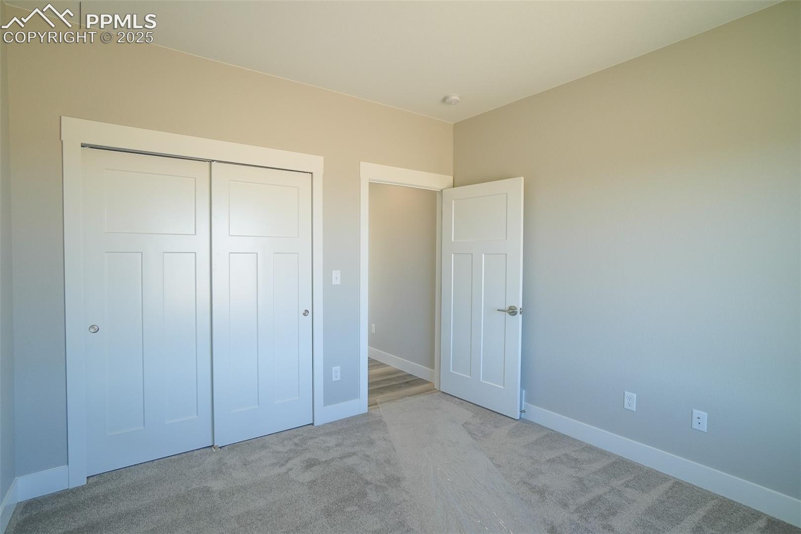 Unfurnished #2 bedroom with light carpet and a closet
