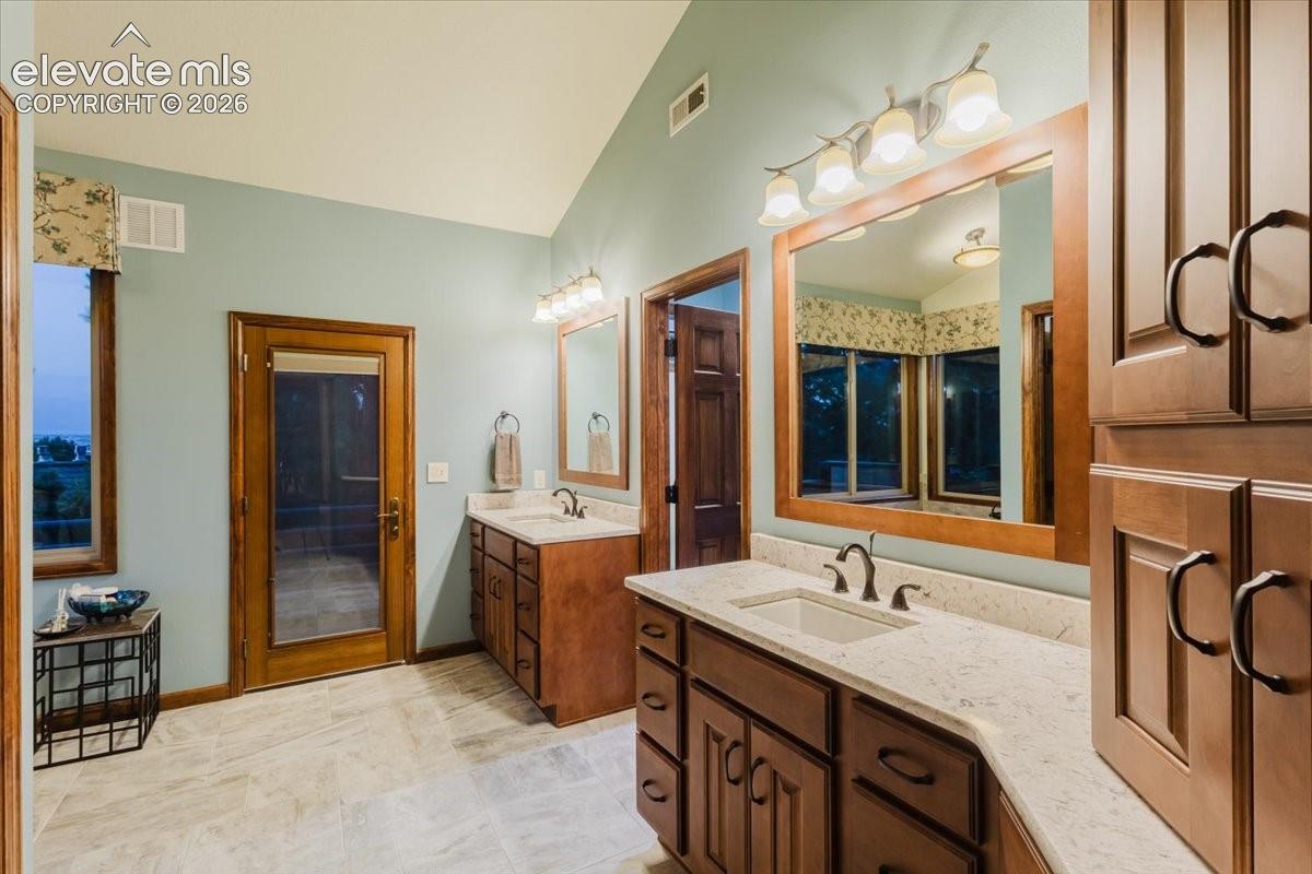 Double vanity with light countertops and undermount sinks