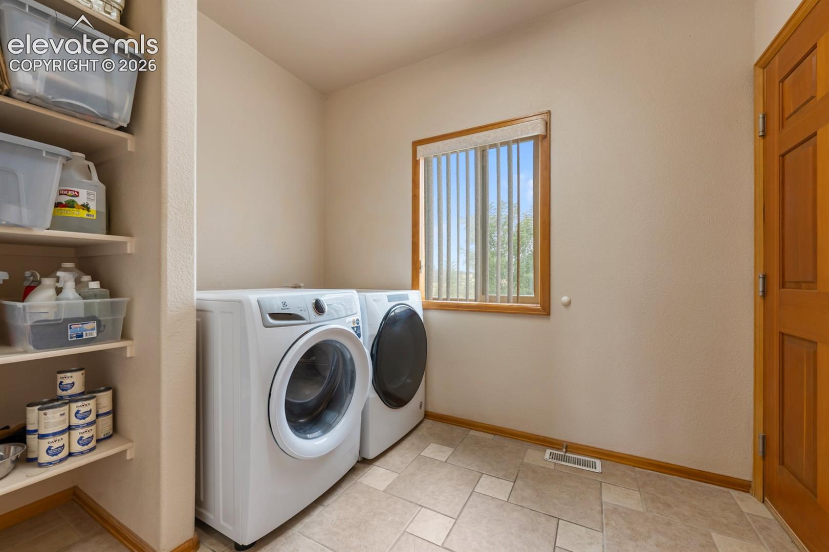 Laundry is on the main level off hall or from the garage.  Washer and dryer stay.  Lots of storage.