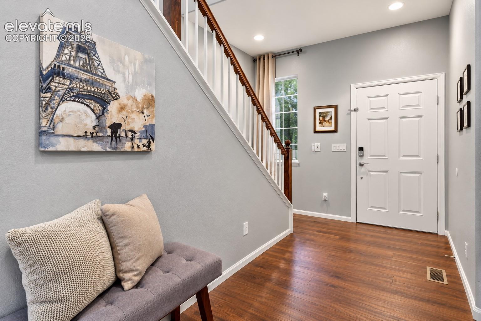 A bright, open foyer welcomes you home with soaring ceilings and an easy flow into the main living spaces.