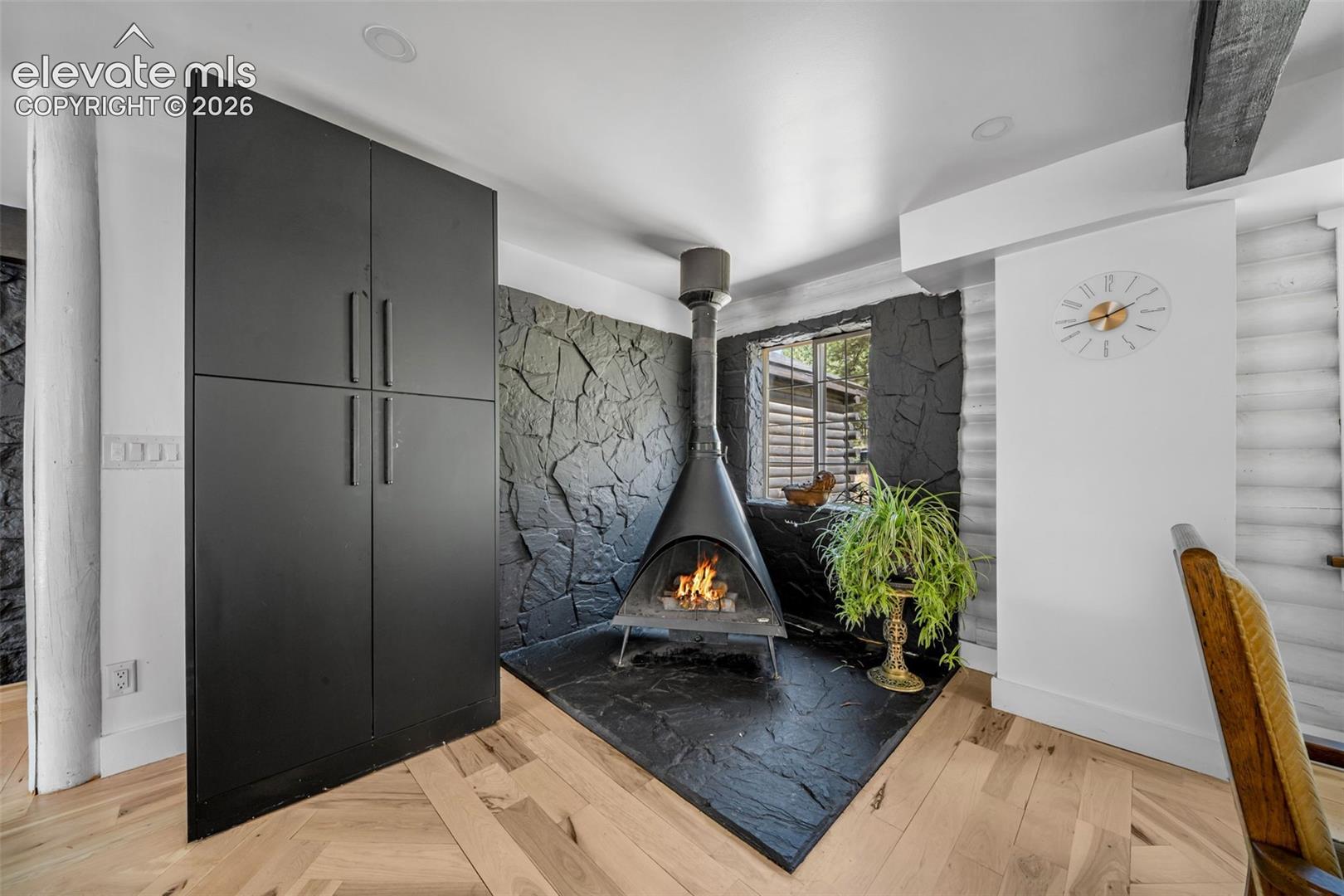 Midcentury woodburning stove in the DR/kitchen 